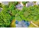 Aerial shot shows the house with a pond in the back at 105 Wittenham Dr, Cary, NC 27519