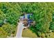 Great curb appeal on this home with a big front yard and lush trees at 105 Wittenham Dr, Cary, NC 27519
