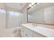 Bathroom featuring a single sink vanity with modern hardware and a large mirror at 105 Wittenham Dr, Cary, NC 27519