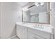 Modern bathroom with double vanity, white countertops, and a large mirror at 105 Wittenham Dr, Cary, NC 27519