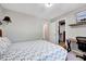 Bedroom featuring a bed, a desk and chair, and a closet for storage at 105 Wittenham Dr, Cary, NC 27519