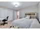 Bedroom with a double door closet and a white comforter on the bed at 105 Wittenham Dr, Cary, NC 27519