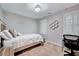 Bedroom with two windows with shutters and a decorative hexagon shelf at 105 Wittenham Dr, Cary, NC 27519