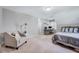 Spacious bedroom with a chair, desk, and comfortable bed at 105 Wittenham Dr, Cary, NC 27519