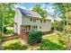 A backyard with a fenced in yard, brick foundation, nice deck and grass in the yard at 105 Wittenham Dr, Cary, NC 27519