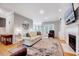 Elegant living room with hardwood floors, fireplace, and comfortable seating arrangement at 105 Wittenham Dr, Cary, NC 27519
