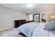 Bright and airy main bedroom with a large closet, carpeted floors, and ample natural light at 105 Wittenham Dr, Cary, NC 27519
