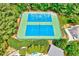 Aerial view of tennis courts nestled among trees, providing a recreational space at 105 Wittenham Dr, Cary, NC 27519