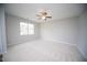 Spacious bedroom featuring a ceiling fan and a large window with natural light at 109 Ambergate Ct, Rocky Mount, NC 27804