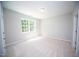 Neutral bedroom with carpet flooring and large window at 109 Ambergate Ct, Rocky Mount, NC 27804