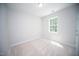 Neutral bedroom with carpet flooring, a large window, and light colored walls at 109 Ambergate Ct, Rocky Mount, NC 27804