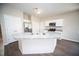 Modern kitchen features a central island with stainless sink, seating, and stainless appliances throughout at 109 Ambergate Ct, Rocky Mount, NC 27804