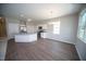 Eat-in kitchen offers stainless appliances, granite countertops, and a dining area with stylish chandelier lighting at 109 Ambergate Ct, Rocky Mount, NC 27804