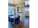 Cozy dining area with a vintage chandelier, dining table, and built-in shelving adjacent to the kitchen at 109 Stephens St, Chapel Hill, NC 27516