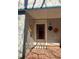 Inviting front door with unique sunflower décor and tiled landing, creating a charming entrance at 109 Stephens St, Chapel Hill, NC 27516