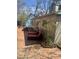 Charming brick patio with lounge chairs, perfect for outdoor relaxation and entertaining at 109 Stephens St, Chapel Hill, NC 27516