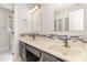 Bright bathroom with double sink vanity, modern mosaic backsplash, and updated fixtures at 1120 Berwyn Way, Raleigh, NC 27615