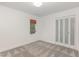 Clean bedroom with soft carpeting, a window for natural light, and sliding closet doors offering ample storage at 1120 Berwyn Way, Raleigh, NC 27615