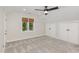 Cozy bedroom with plush carpeting, a ceiling fan, natural light, and ample closet space for added comfort at 1120 Berwyn Way, Raleigh, NC 27615