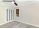 Comfortable bedroom featuring soft carpeting, natural light from the window, and closet with sliding doors at 1120 Berwyn Way, Raleigh, NC 27615
