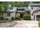 Exterior of the house with a stone facade entrance, well-maintained landscaping, and a driveway at 1120 Berwyn Way, Raleigh, NC 27615