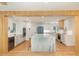 Open concept kitchen with a marble island, modern appliances, and ample cabinet space at 1120 Berwyn Way, Raleigh, NC 27615