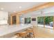 Bright, open kitchen with marble island, wood accents, and access to the outdoor deck, perfect for entertaining at 1120 Berwyn Way, Raleigh, NC 27615