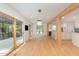 Spacious living area with hardwood floors, modern lighting, and access to outdoor deck at 1120 Berwyn Way, Raleigh, NC 27615