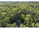 Beautiful aerial view of a wooded lot featuring a hidden home among tall, dense trees at 13 Crosswinds Estates Dr, Pittsboro, NC 27312