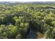 Stunning wooded lot featuring a tranquil pond and secluded home in a forest setting at 13 Crosswinds Estates Dr, Pittsboro, NC 27312