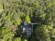 Beautiful wooded lot featuring a home and long driveway, all surrounded by lush trees at 13 Crosswinds Estates Dr, Pittsboro, NC 27312