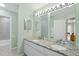 Bathroom with a double vanity, granite countertops, and a well-lit mirror at 13 Crosswinds Estates Dr, Pittsboro, NC 27312