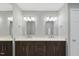 Modern bathroom with double vanity, large mirrors, and stylish lighting fixtures at 13 Crosswinds Estates Dr, Pittsboro, NC 27312