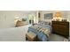 Cozy bedroom featuring a sliding glass door to the outside and neutral decor at 13 Crosswinds Estates Dr, Pittsboro, NC 27312