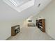 Bright bonus room featuring a skylight and ample storage space, and neutral decor at 13 Crosswinds Estates Dr, Pittsboro, NC 27312