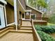 Wood deck with stairs to backyard at 13 Crosswinds Estates Dr, Pittsboro, NC 27312
