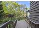 Wood deck with stairs to the backyard and view of the landscape at 13 Crosswinds Estates Dr, Pittsboro, NC 27312