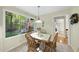 A dining room filled with natural light. A table with four wooden chairs is present at 13 Crosswinds Estates Dr, Pittsboro, NC 27312