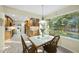 A dining room and connected kitchen area, with an outdoor view and table at 13 Crosswinds Estates Dr, Pittsboro, NC 27312