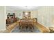 Dining room featuring hardwood floors, a decorative rug and a chandelier at 13 Crosswinds Estates Dr, Pittsboro, NC 27312