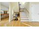 Inviting foyer featuring hardwood floors, a staircase, and ample natural light at 13 Crosswinds Estates Dr, Pittsboro, NC 27312