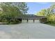 Attached three-car garage with a large driveway, ideal for car enthusiasts at 13 Crosswinds Estates Dr, Pittsboro, NC 27312