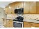A spacious kitchen with granite countertops, stainless steel appliances and wood cabinets at 13 Crosswinds Estates Dr, Pittsboro, NC 27312