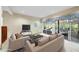 Living room furnished with an area rug, neutral furniture and a sliding glass door at 13 Crosswinds Estates Dr, Pittsboro, NC 27312