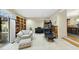 Spacious living room with custom bookshelves, piano, and comfortable seating at 13 Crosswinds Estates Dr, Pittsboro, NC 27312