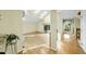 Bright living room featuring hardwood floors, skylights, and sliding door access to the deck at 13 Crosswinds Estates Dr, Pittsboro, NC 27312