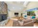 Staged living room with stone fireplace, skylights and stylish furnishings at 13 Crosswinds Estates Dr, Pittsboro, NC 27312
