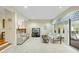 Bright living room with neutral carpet, large screen tv and a sliding glass door to the outdoors at 13 Crosswinds Estates Dr, Pittsboro, NC 27312
