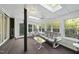 Bright sunroom with skylights, comfortable seating, and natural views at 13 Crosswinds Estates Dr, Pittsboro, NC 27312