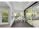 Enclosed porch with seating provides peaceful views of the backyard at 13 Crosswinds Estates Dr, Pittsboro, NC 27312